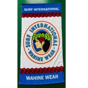 A towel with the words surf international wahines wear on it.